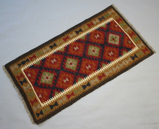 A black, red and tan ground Maimana Kilim rug with 4 diamonds to the centre 154cm x 80cm 