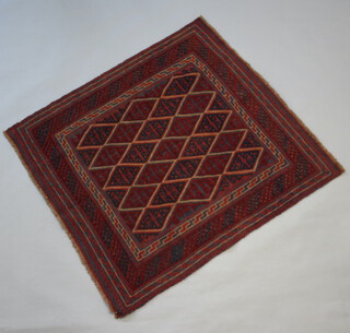 A blue and red ground Meshwani Gazak rug with central diamond shaped field 124cm x 115cm 