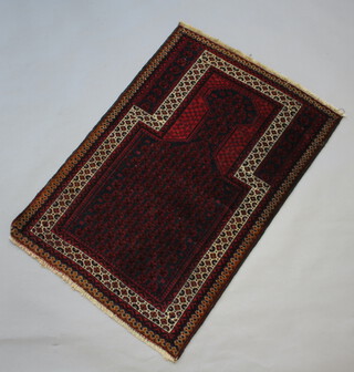 A red and blue ground Belouche prayer rug 128cm x 88cm 