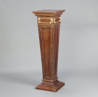 An Edwardian square carved walnut tapered pedestal with blind fretwork decoration,  raised on a shaped base 104cm h x 33cm  