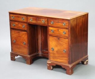 A 19th Century mahogany pedestal dressing table fitted and arrangement of 5 drawers, the pedestal enclosed by a panelled door, raised on bracket feet 77cm h x 107cm w x 49cm d  