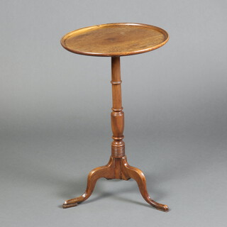 A 19th Century circular mahogany dish top wine table, raised on turned column and tripod base 70cm h x 44cm diam. 