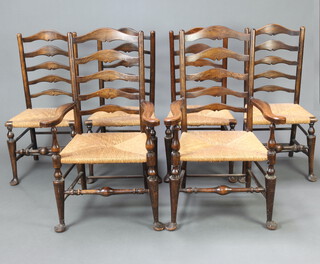 A set of 6 17th Century style beech and elm ladder back dining chairs with woven rush seats comprising 2 carvers 96cm h x 65cm w x 53cm d (seat 30cm x 30cm) and 4 standard chairs 98cm h x 48cm w x 39cm d (seat 29cm x 28cm) 