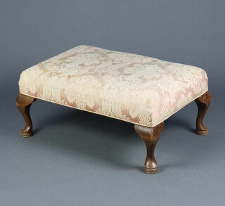 A Queen Anne style footstool with overstuffed seat, raised on cabriole supports 34cm h x 77cm w x 52cm d 