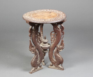 A Victorian circular carved and pierced hardwood occasional table, raised on 3 pierced supports decorated mythical beasts 60cm h x 45cm diam. 
