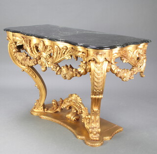 A 20th Century Empire style faux marble and carved gilt hardwood console table of serpentine outline raised on cabriole supports 90cm h x 134cm w x 60cm d 