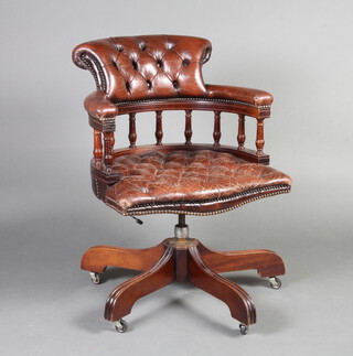 A mahogany revolving Captain's desk chair, upholstered in buttoned leather 85cm h x 60cm w x 53cm d (seat 40cm x 37cm) 