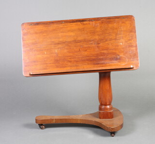 A Victorian adjustable mahogany bed table on a shaped base 71cm h x 82cm w x 40cm d  
