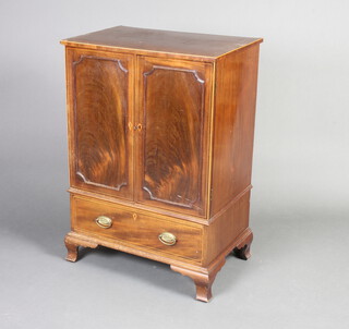 A 19th Century inlaid mahogany cabinet fitted a cupboard enclosed by panelled doors, the base fitted a drawer, raised on ogee bracket feet 88cm h x 61cm w x 41cm d 