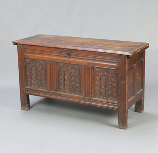 A 17th/18th Century oak coffer of panelled construction with hinged lid, the interior fitted a candle box, 70cm h x 120cm w x 48cm d
