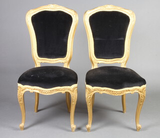 A pair of gilt painted salon chairs upholstered in black material 101cm h x 47cm w x 47cm d (seat 31cm x 30cm d) 
