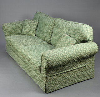 A Delcor two seat sofa upholstered in green material 90cm h x 213cm w x 93cm d (seat 164cm x 50cm) 