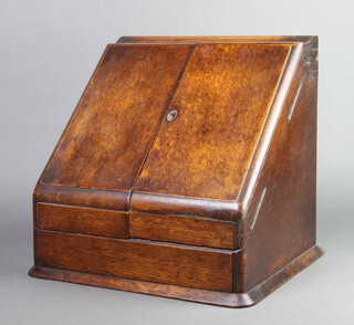 A Victorian wedge shaped oak stationery box with hinged lid, the base fitted a drawer 32cm h x 33cm w x 28cm d 