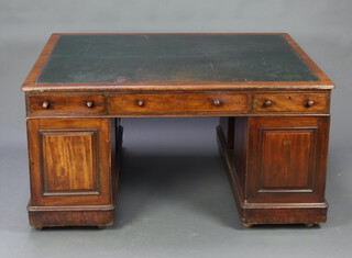 A Victorian mahogany partners desk with inset tooled leather writing surface, the upper section fitted 2 long and 2 short drawers, the pedestals fitted 3 drawers enclosed by a panelled door and cupboard enclosed by a panelled door 74cm h x 152cm w x 123cm d 