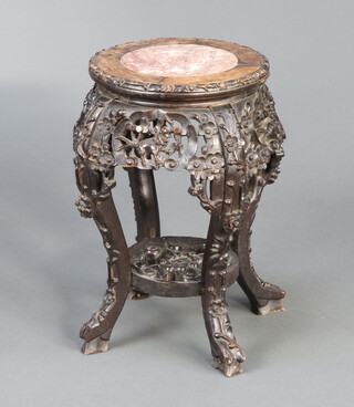 A 19th Century circular Chinese pierced and carved hardwood jardiniere stand with pink veined marble top, raised cabriole supports 46cm h x 28cm diam. 