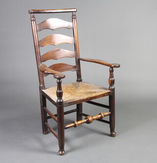 An 18th/19th Century elm ladder back carver chair with woven rush seat, raised on club supports 108cm h x 62cm w x 50cm d (seat 35cm x 30cm) 