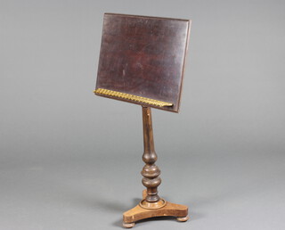 A William IV rectangular mahogany adjustable reading stand with brass gallery, raised on turned column and triform base 116cm h x 60cm w x 46cm d 
