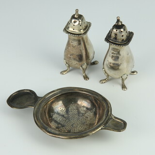 A silver tea strainer Sheffield 1906 together with 2 condiments 100 grams 