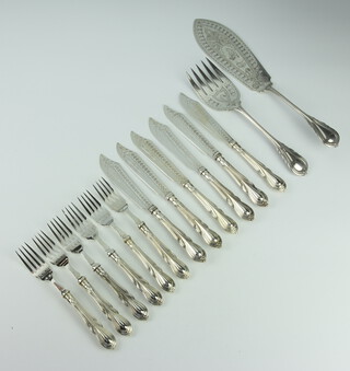 A pair of Edwardian silver plated lily pattern fish servers together with a set of fish eaters for 6 