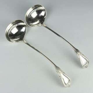 A pair of silver plated lily pattern ladles