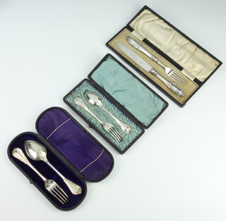 A cased pair of silver plated lily pattern spoon and fork, ditto and a knife and fork 