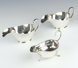 A stylish pair of silver plated sauce boats and 1 other 