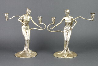 A pair of Art Nouveau style silver plated 2 light candlesticks in the form of semi-clad ladies 30cm