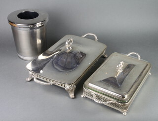 Two silver plated vegetable dishes with glass liners and a bottle cooler 