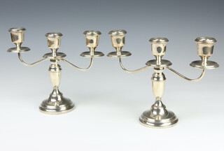 A pair of silver 3 light candelabra Birmingham 1971 20cm (weighted bases) 