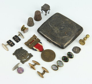 A silver cigarette case (rubbed marks) 72 grams gross and minor badges, etc 