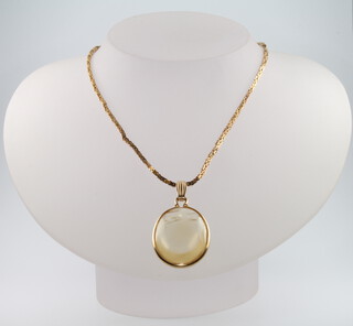 A 9ct yellow gold necklace 8.5 grams, 37cm together with a 14ct yellow gold plated hardstone pendant 
