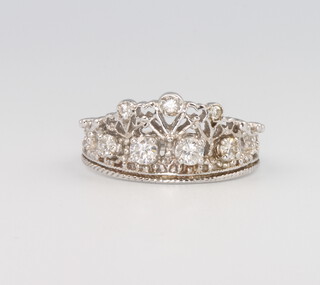 A 14ct white gold diamond set tiara shaped ring 0.5ct, size O 1/2, 3.5 grams 