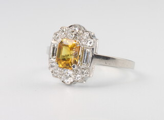 A platinum yellow sapphire and diamond cocktail ring, the centre sapphire 1.3ct, the brilliant and baguette diamonds 0.55ct, with WGI certificate, 4.3 grams, size N 1/2