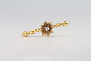 An 18ct yellow gold diamond set bar brooch 2.3 grams, set with a 0.10ct diamond, 3.5cm 