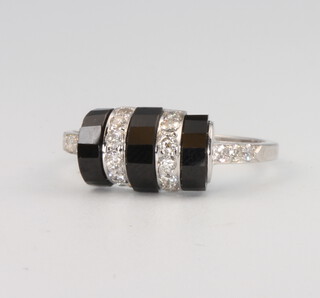 A 14ct white gold onyx and diamond cocktail ring, 4 grams, size N 