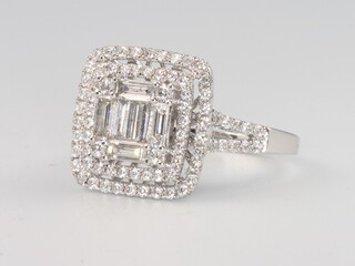 An 18ct white gold baguette and brilliant cut diamond cluster ring 1.25ct, 4.9 grams, size N 