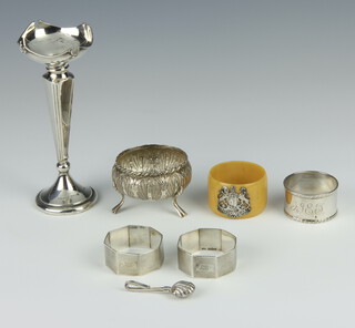 A pair of silver engine turned napkin rings Birmingham 1939, 1 other and an Indian table salt (86 grams), together with a silver spill vase and a mounted serviette ring, weighable silver 66 grams and an Eastern silver mustard  