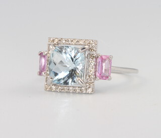 An 18ct white gold aquamarine, diamond and pink sapphire ring, the centre stone approx 2ct, the diamonds 0.2ct, the 2 pink sapphires approx. 0.5ct, 3.5 grams, size L 1/2