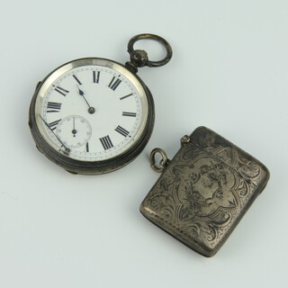 An Edwardian silver vesta with chased decoration, Chester 1907 together with a silver cased mechanical pocket watch (a/f) 28 grams 