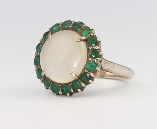 A silver moonstone and green stone dress ring, size M, 6 grams