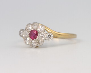 A gold and platinum Edwardian style ruby and diamond cluster ring, the ruby 0.25ct, the brilliant cut diamonds approx. 0.4ct, 2.8 grams, size N 1/2
