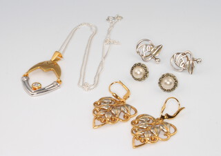 A pair of silver gilt pierced earrings, a ditto pendant and chain and 2 pairs of silver earrings, gross weight 18.2 grams 
