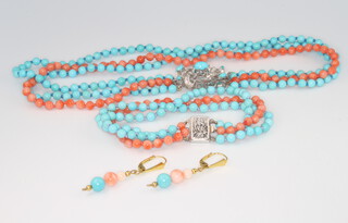 A white metal clasp coral and turquoise 3 string necklace 33cm together with an ensuite bracelet 16cm and a similar pair of pierced ear drops 