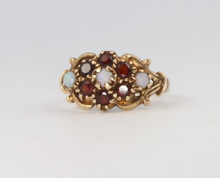 A 9ct yellow gold opal and garnet ring 3.2 grams, size L