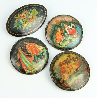 A 20th Century painted Russian papier mache brooch depicting a hunting scene 5cm, 3 others 