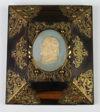 A 2 colour Jasperware oval portrait of Shakespeare mounted on a Victorian brass and coromandel plaque 16cm x 14cm 