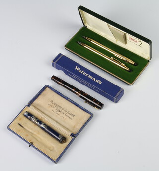 A cased Cross gilt propelling pencil and pen, 2 other pens 