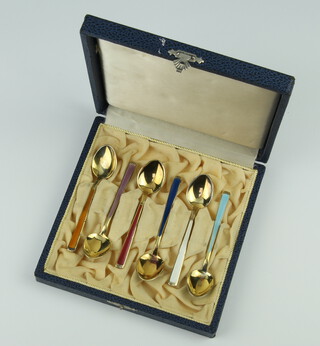 A set of 6 silver gilt and enamelled coffee spoons cased, 70 grams, 9cm 