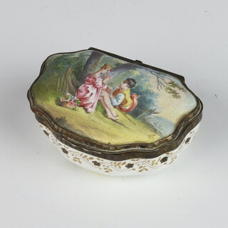 An early 19th Century Battersea style enamelled snuff box, the lid decorated with a fete gallant scene, the interior with a cupid above a statue, having gilt metal mounts 5cm 