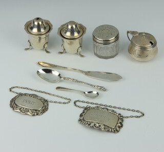 A silver butter knife, 3 condiments, 2 spirit labels, 2 spoons and a mounted box, weighable silver 174 grams